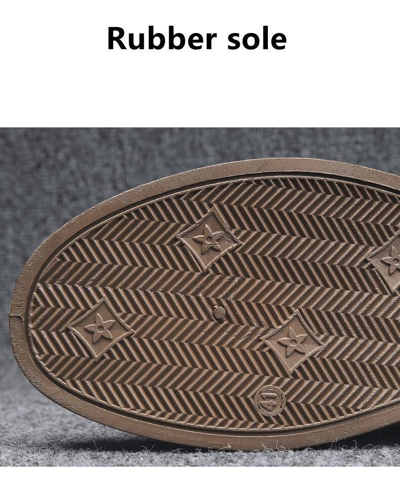 Men's winter boot outsole close-up with herringbone tread pattern and star grips