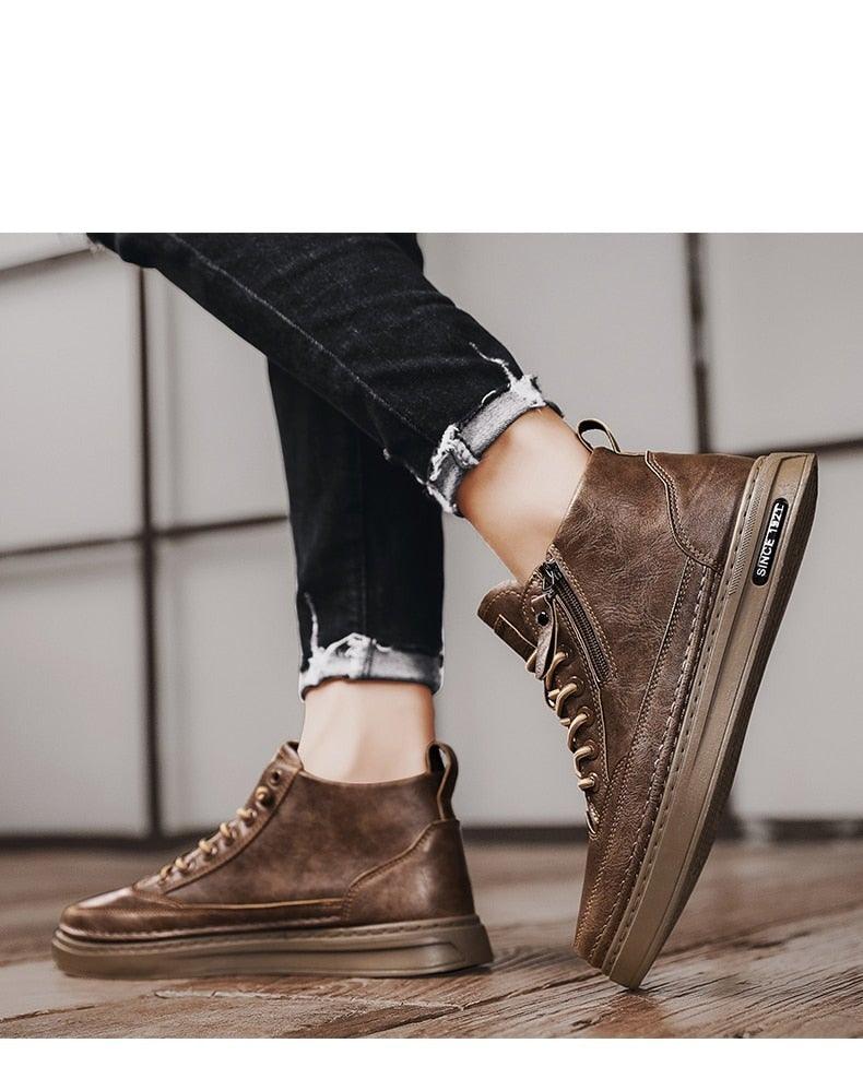 Men's winter high-top boots in brown with lace-up and side zipper, worn with dark jeans