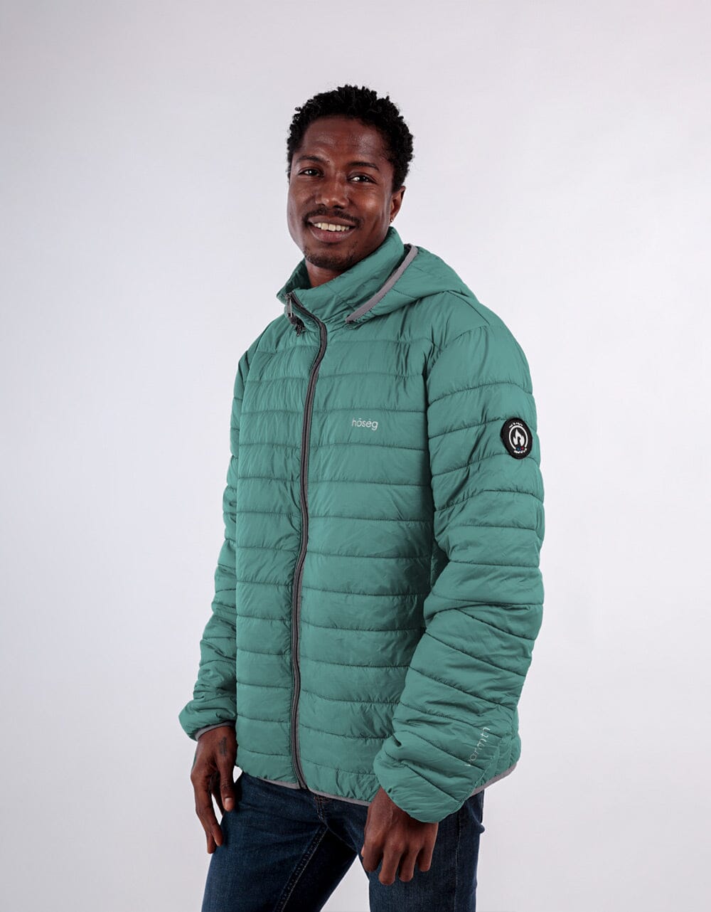 Men's teal puffer alpaca jacket with full-zip front and stand collar