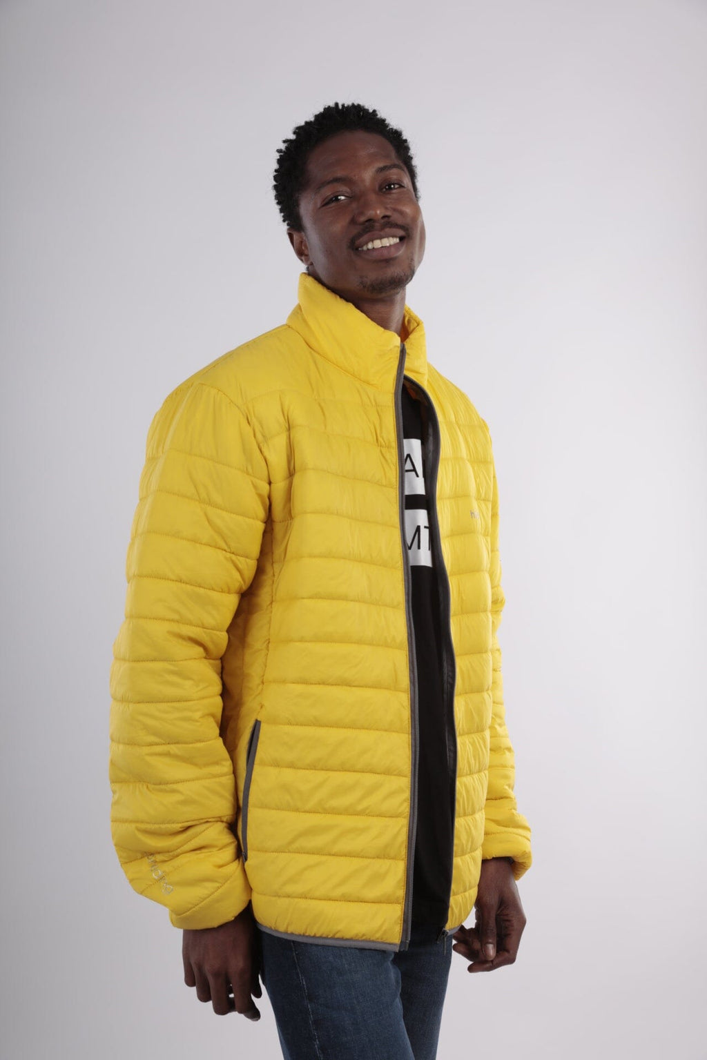 Men's yellow puffer alpaca jacket with full-zip front and dark inner collar
