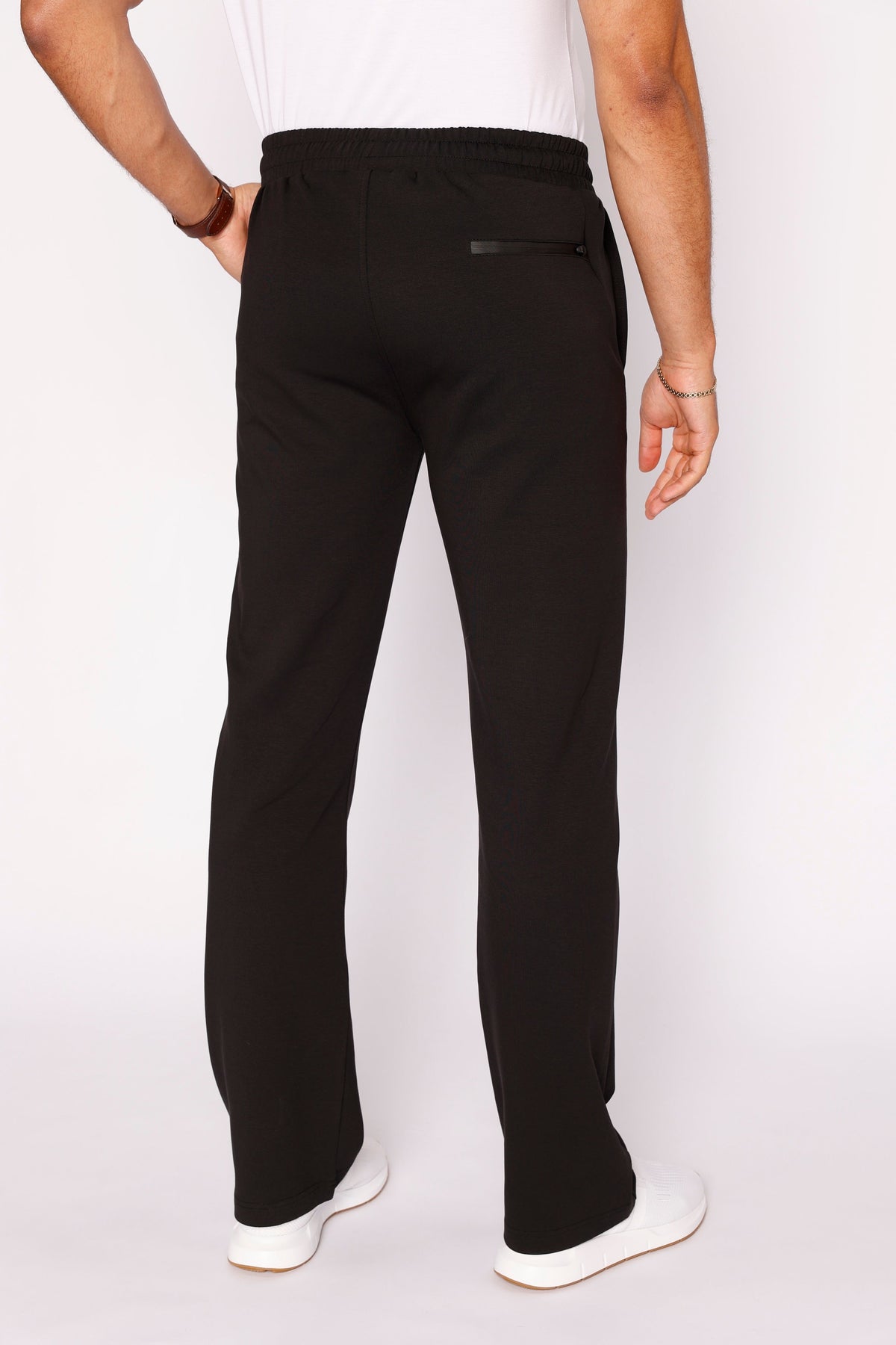 Black straight-fit sweatpants with elastic waistband and drawstring, tapered straight legs.