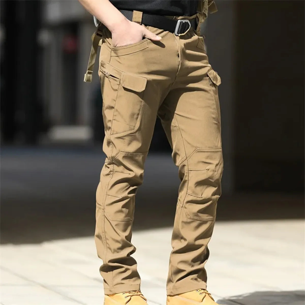 Beige men's cargo pants with side utility pockets and belt loops