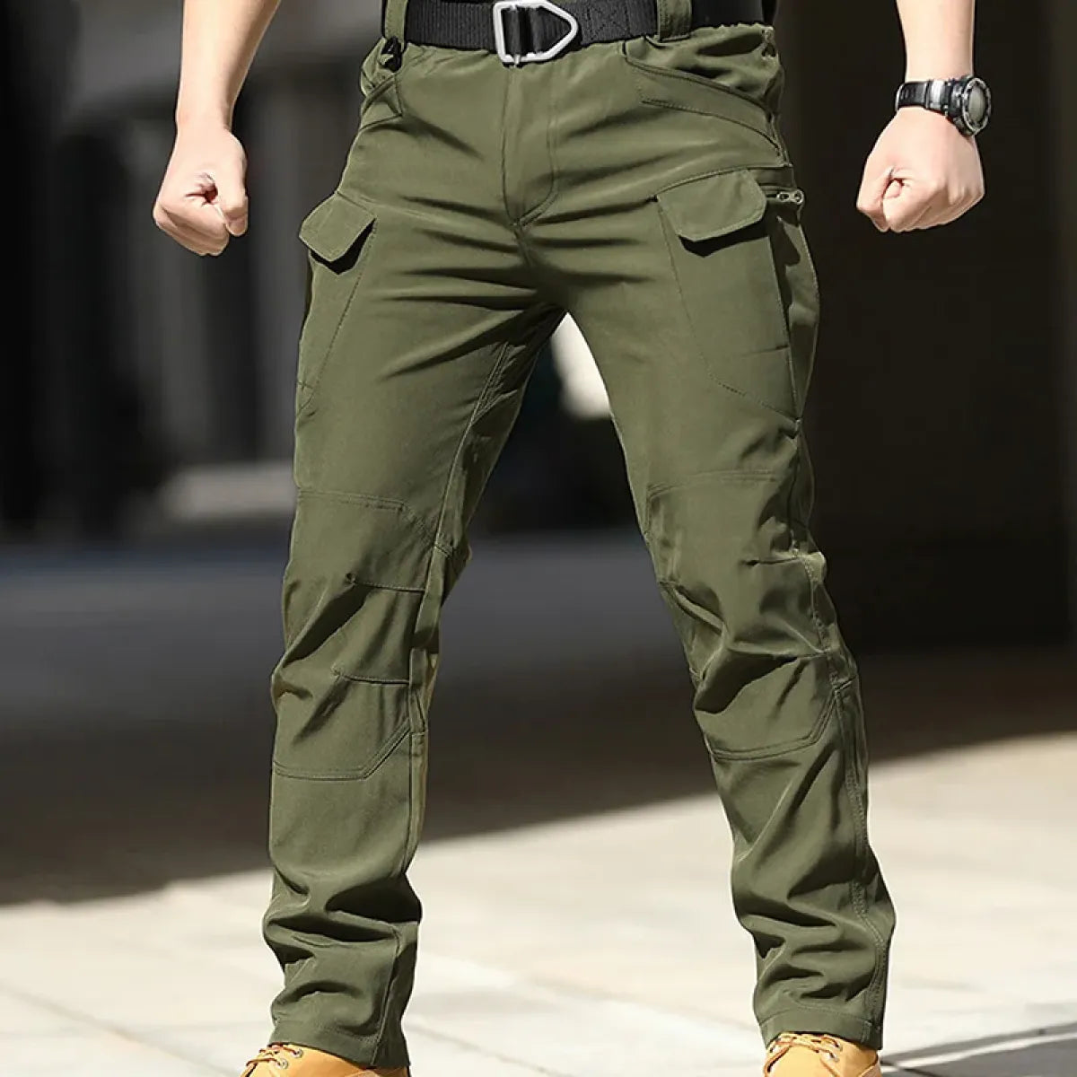 Olive green men's cargo pants with side pockets and belt loops