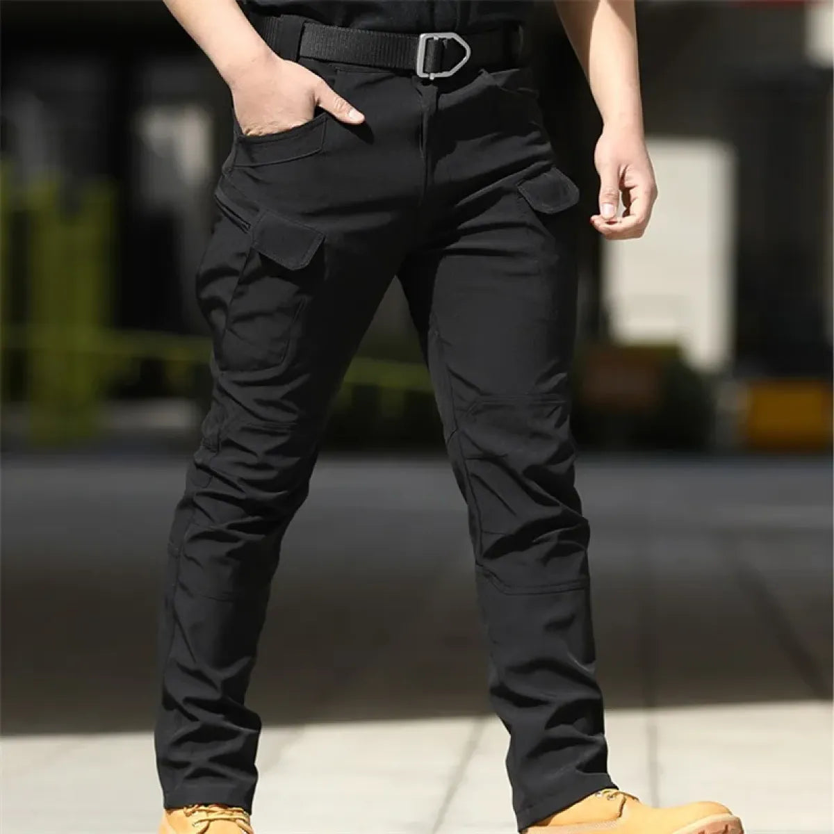 Black men's cargo pants with thigh pockets and tapered leg fit
