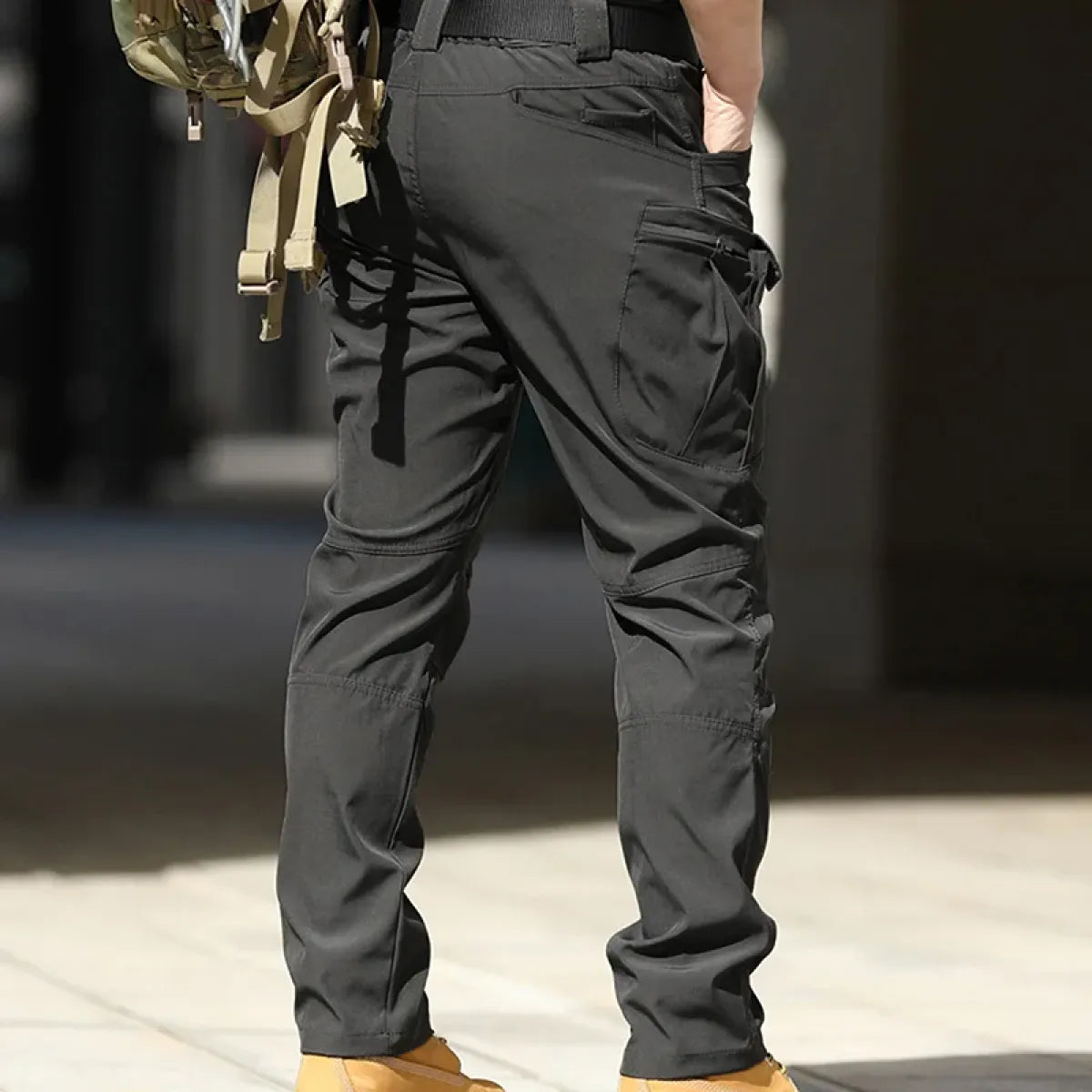 Dark gray men's cargo pants with large cargo pockets and belt loops