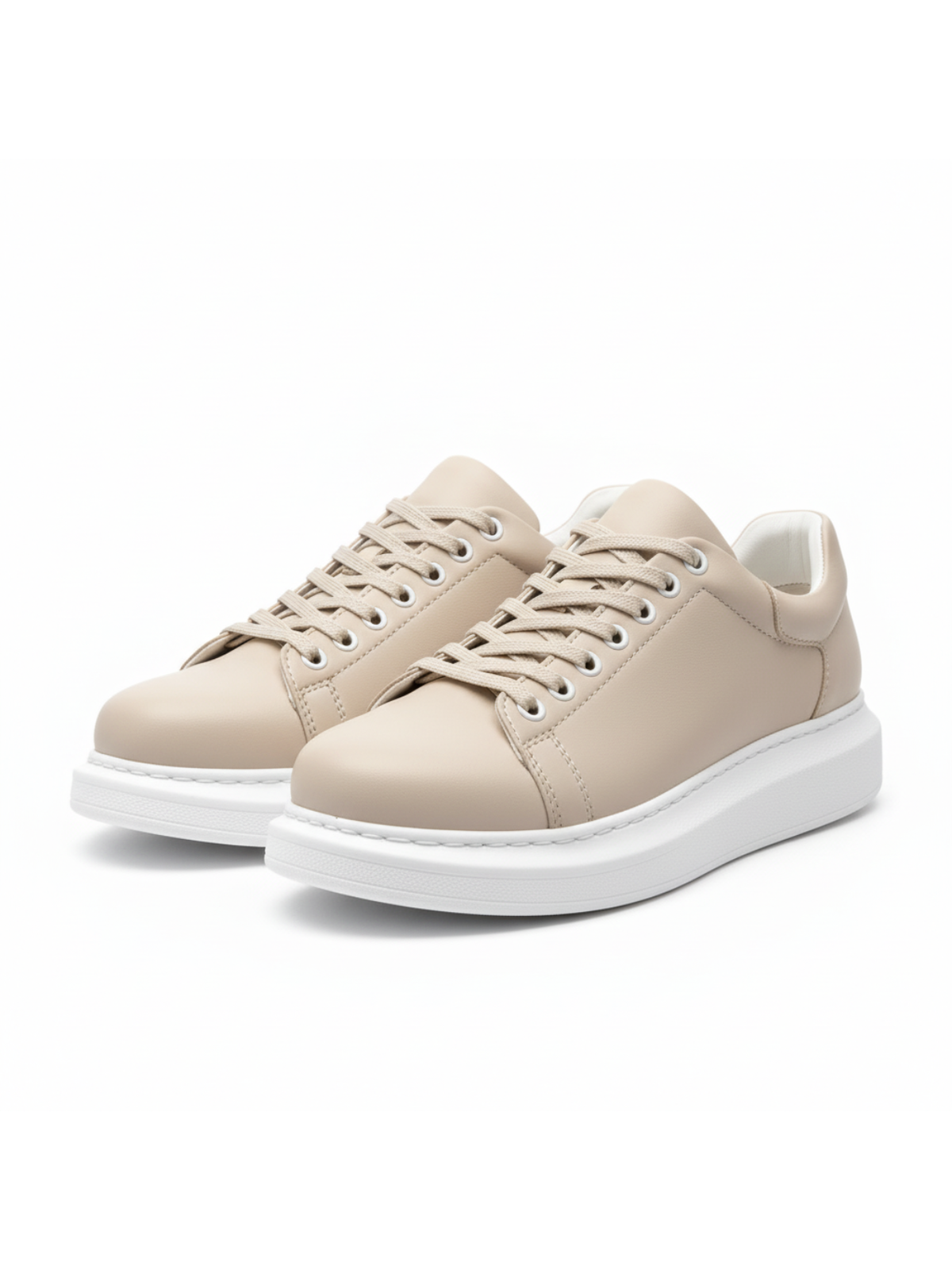 Pair of cream low-top lace-up sneakers with white rubber sole