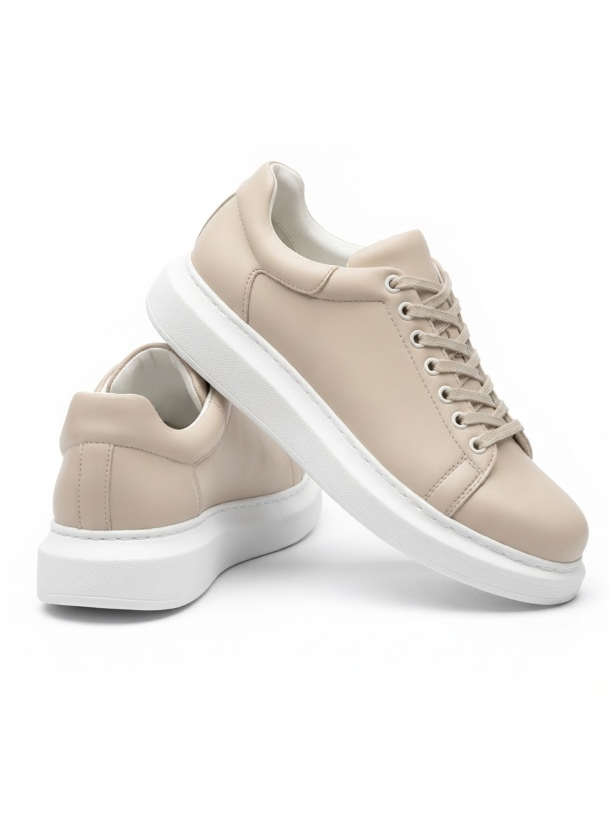 Cream low-top lace-up sneakers with white sole and rounded toe