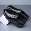 Men's black PU loafers, stitched slip-on design with soft rubber sole