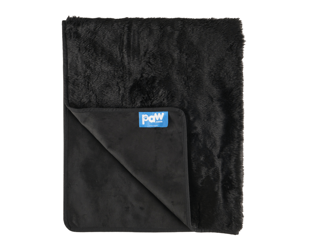 Midnight black faux-fur throw blanket with inner waterproof layer and logo label.
