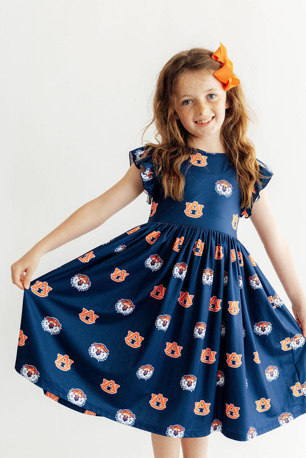 Aubie flutter twirl dress with full twirl skirt, cap sleeves, and allover logo print