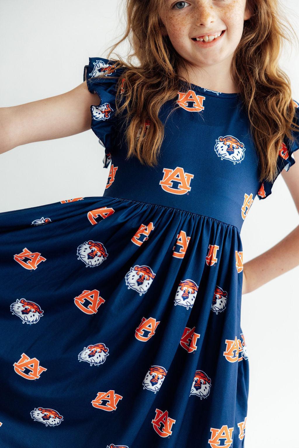 Aubie flutter twirl dress close-up with ruched waist and Auburn logo print