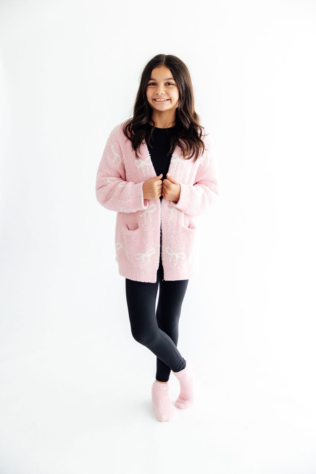 Light pink bow cozy cardigan with open front, full-body front view