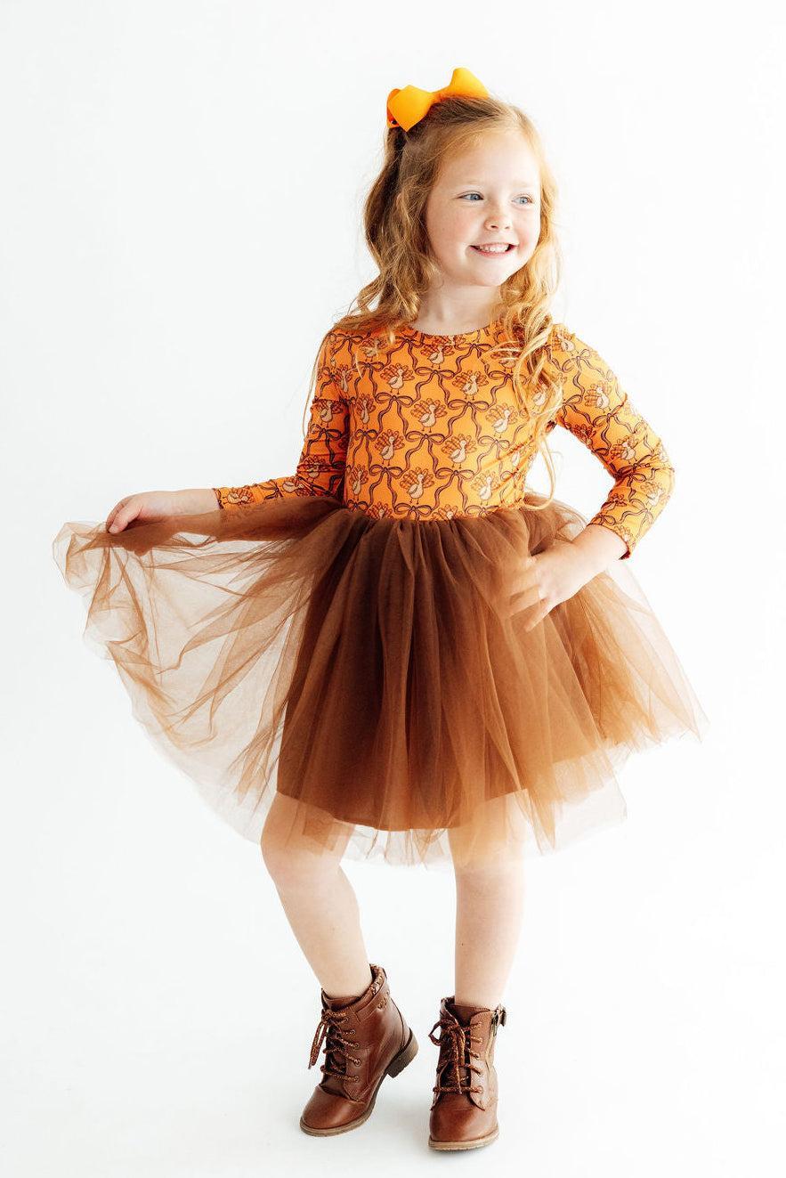 Orange long-sleeve girls' dress with turkey print and brown tulle skirt, bow headband