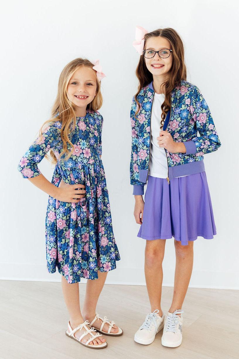 Floral satin zip jacket with purple hem band, blue and pink flower print