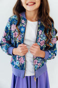 Floral satin zip jacket with purple ribbed cuffs and hem, blue and pink flower print