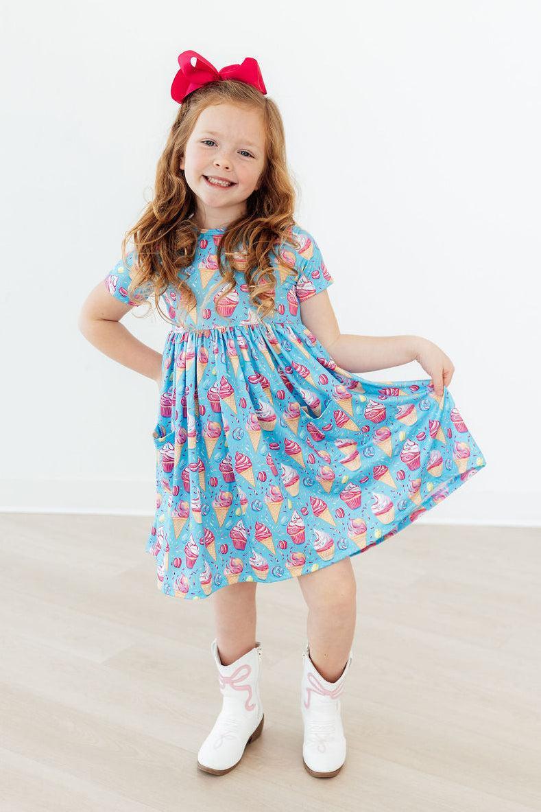 Light blue dessert-print short-sleeve twirl dress with flared gathered skirt
