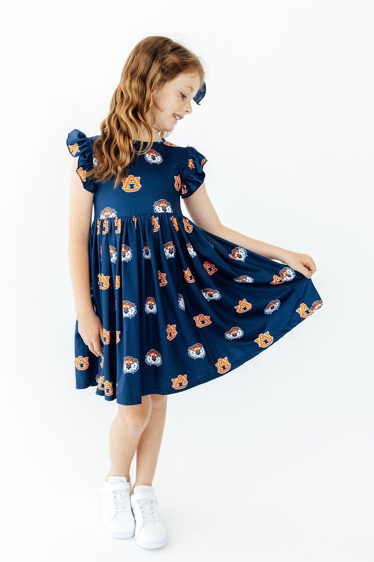 Aubie flutter twirl dress side view with cap flutter sleeves and logo-print skirt