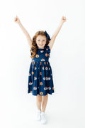 Aubie flutter twirl dress in Auburn blue with cap sleeves and allover logo print