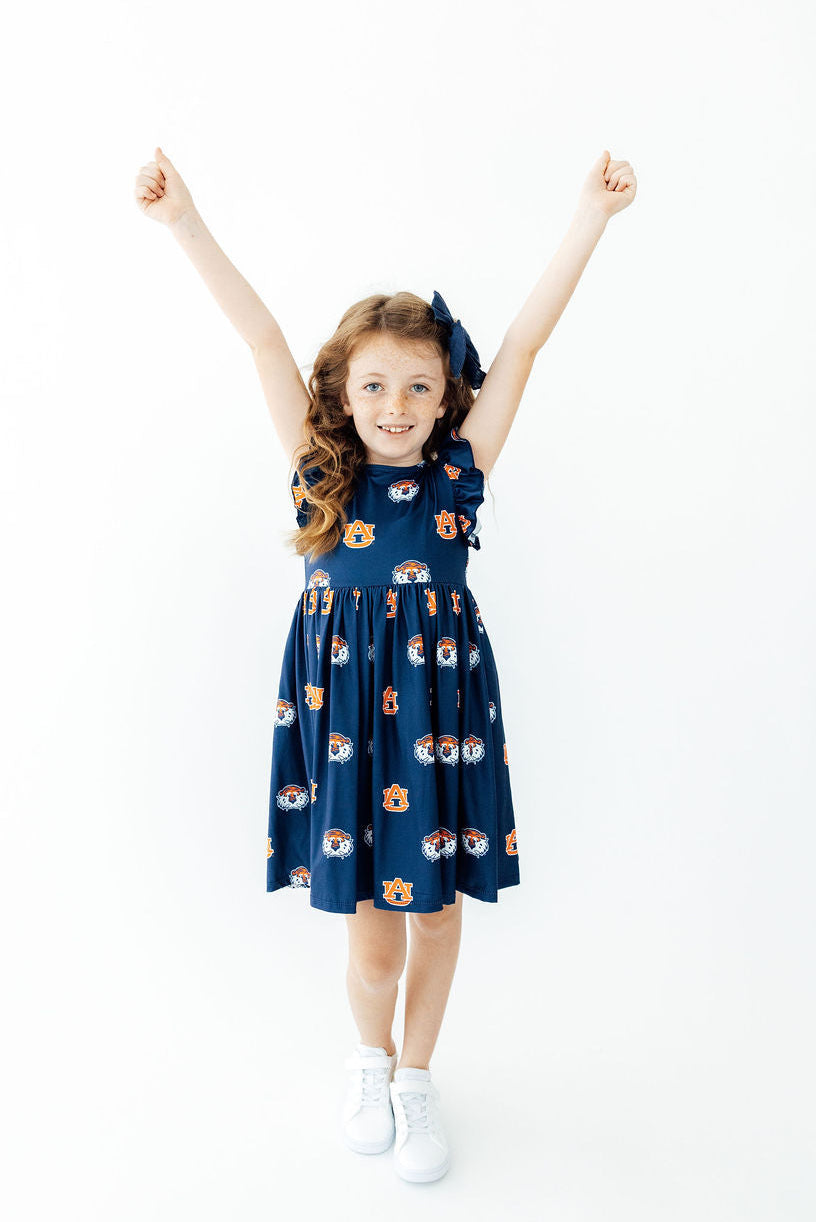 Aubie flutter twirl dress in Auburn blue with cap sleeves and allover logo print