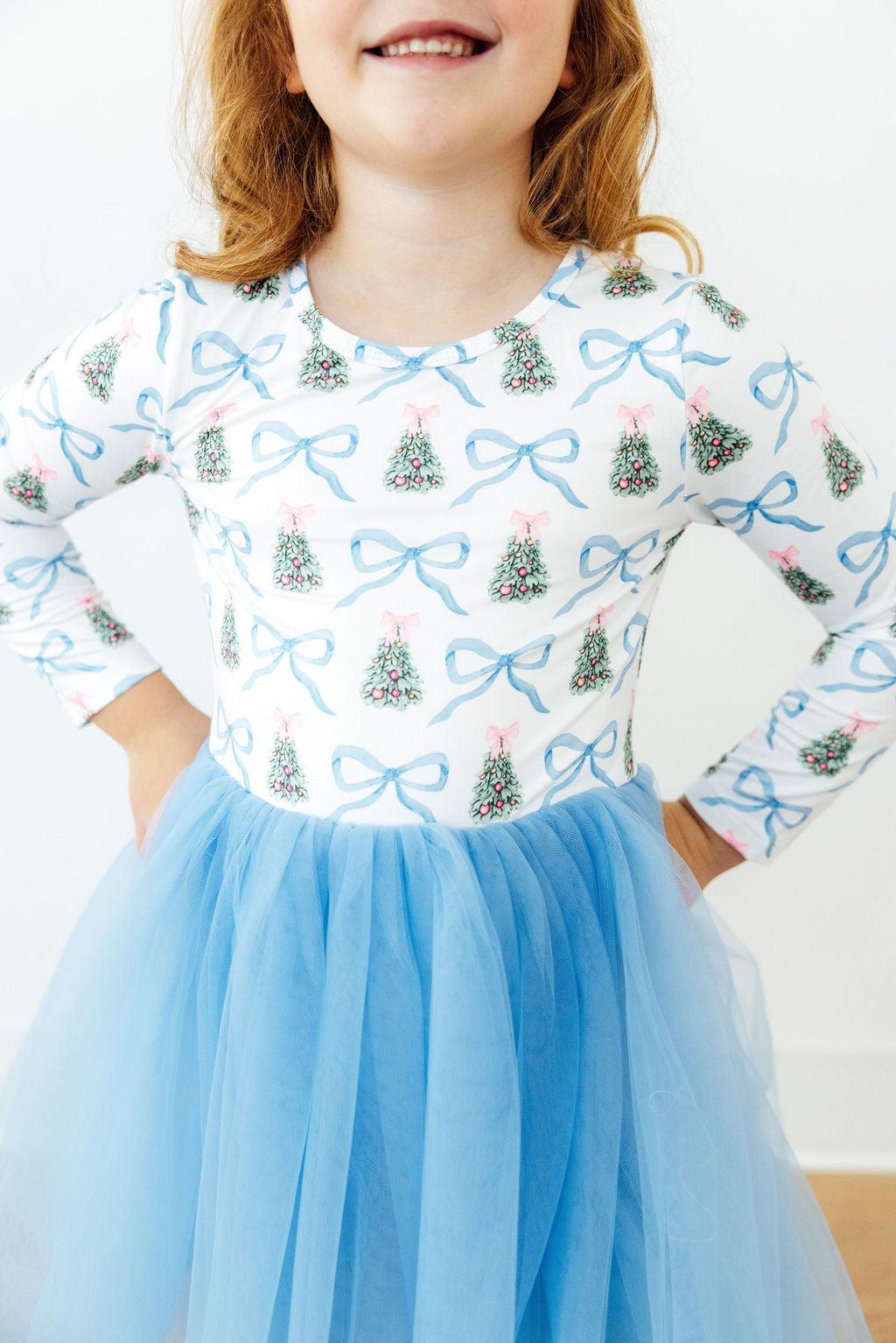 White long-sleeve Christmas tutu dress, blue tree-and-bow print bodice, light blue skirt