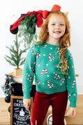 Kids teal Christmas sweater with white and red candy cane pattern, long sleeves, crew neck