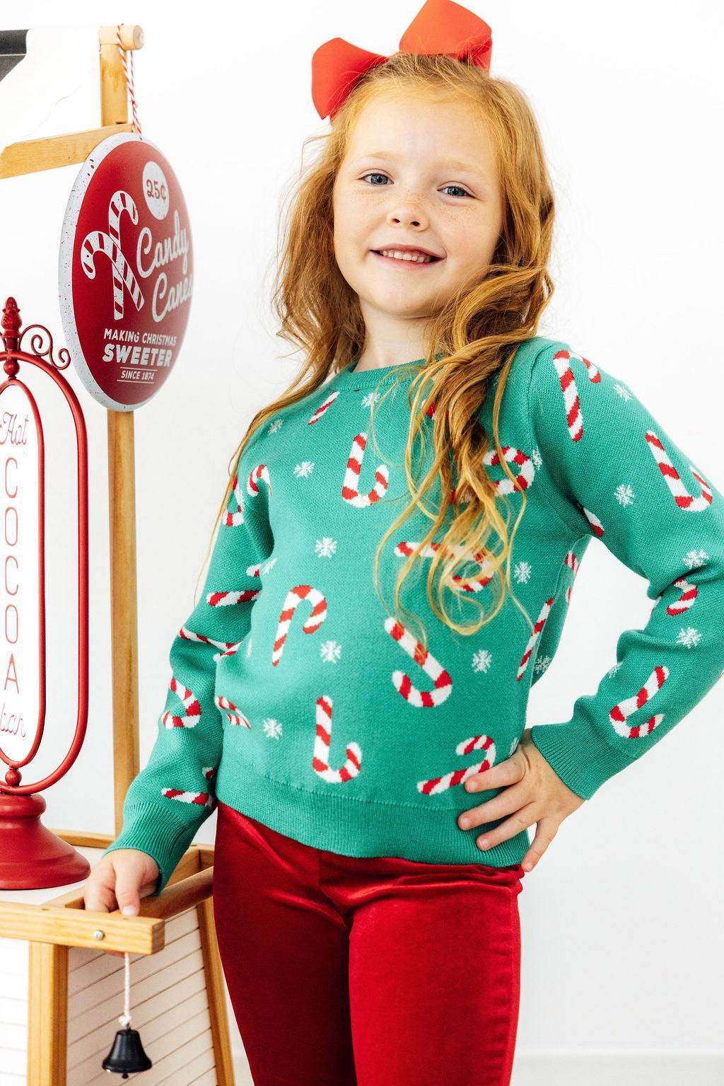 Kids teal Christmas sweater with festive candy cane prints, long sleeves, crew neck