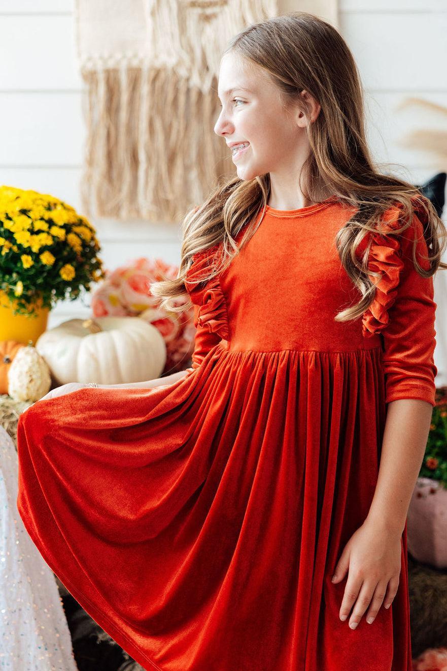 Orange velvet ruffle-sleeve twirl dress with gathered waist and flared skirt