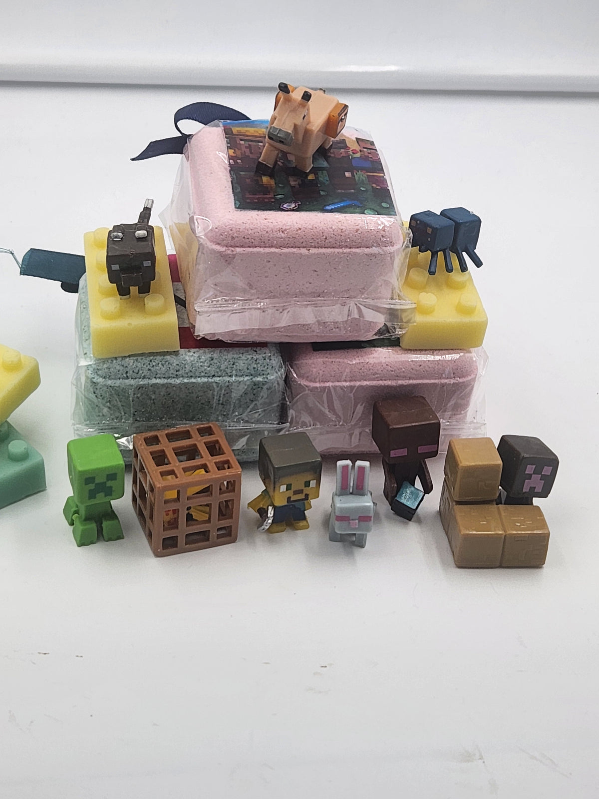 Kid bath bomb set with stacked bars and small Minecraft-style toy figures