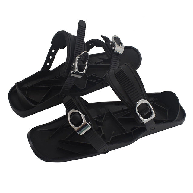 Mini ski skates pair, black platforms with silver buckle straps