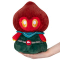 Mini plush monster toy with red hood, big yellow eyes, teal collar, green body