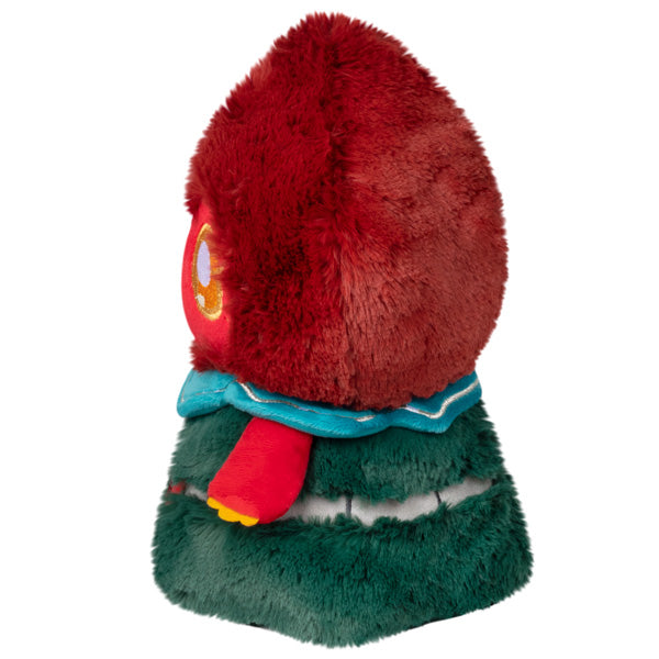 Mini plush monster, side view: red shaggy hood, teal collar, green layered body