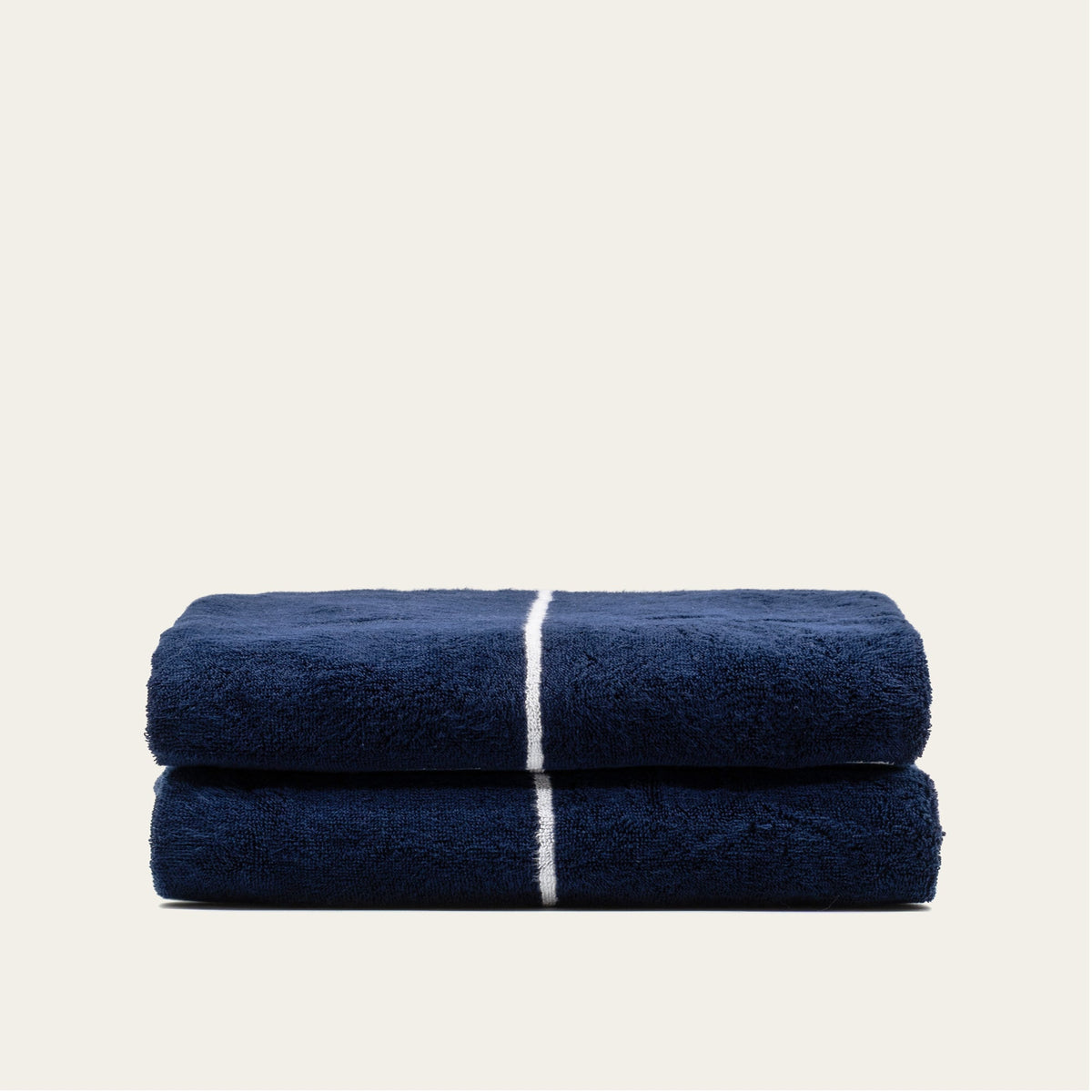 Navy and white striped cotton towels, folded stack of two