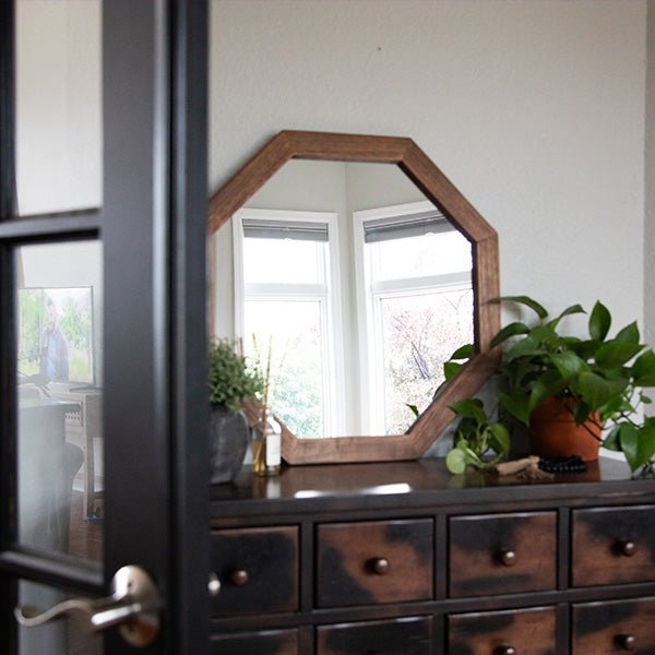 Octagon wood frame mirror with brown octagonal frame and clear glass on console