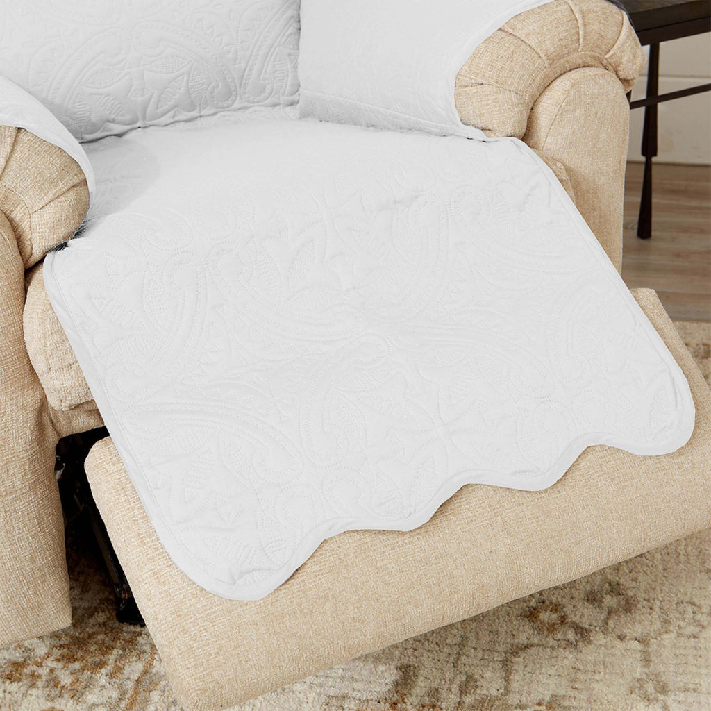White loveseat seat protector with scalloped quilted edge detail