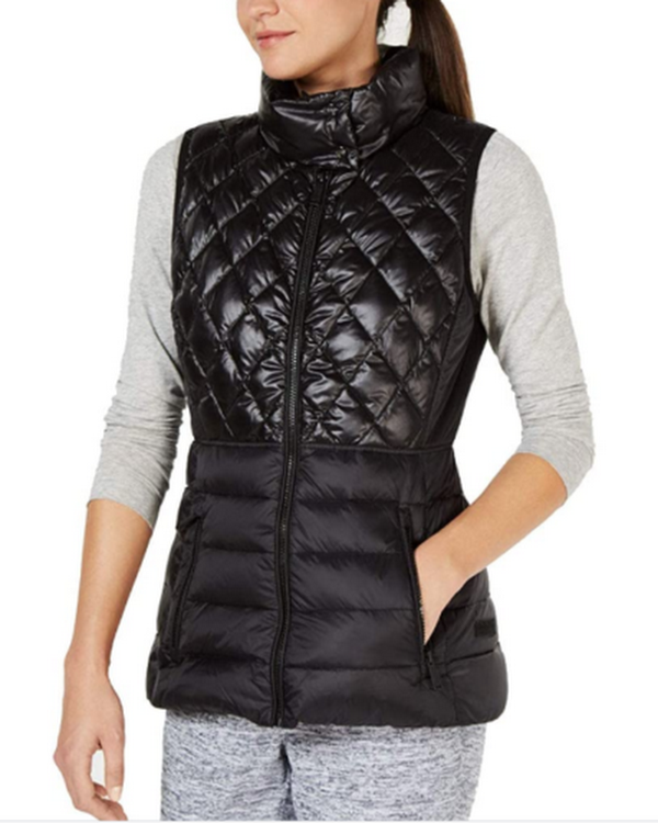 Calvin Klein women's black quilted puffer vest with front zip and stand collar.