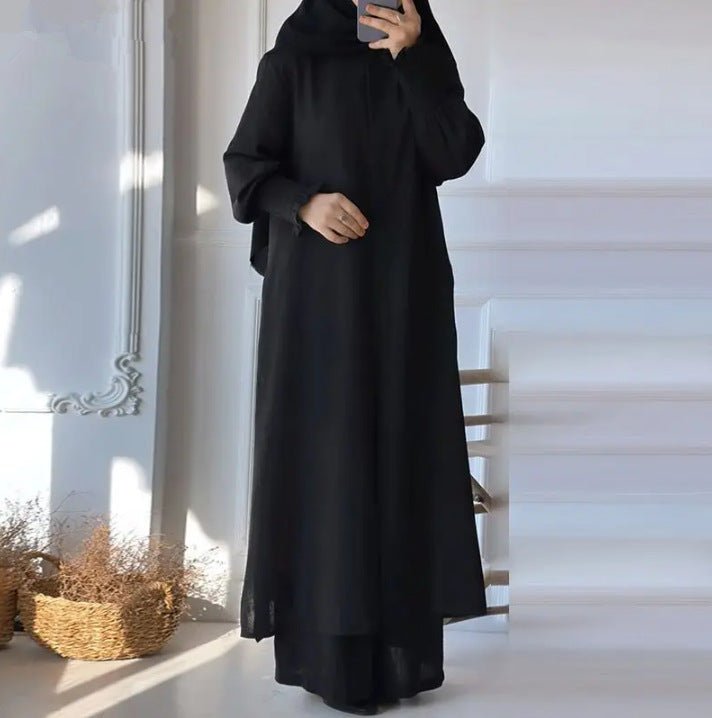 Black long-sleeve button-front shirt and loose long pants set, flowing drape