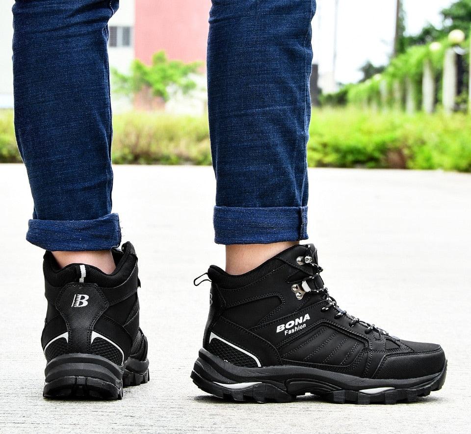 Men's black high-top hiking boots with lace-up front and cushioned heel collar