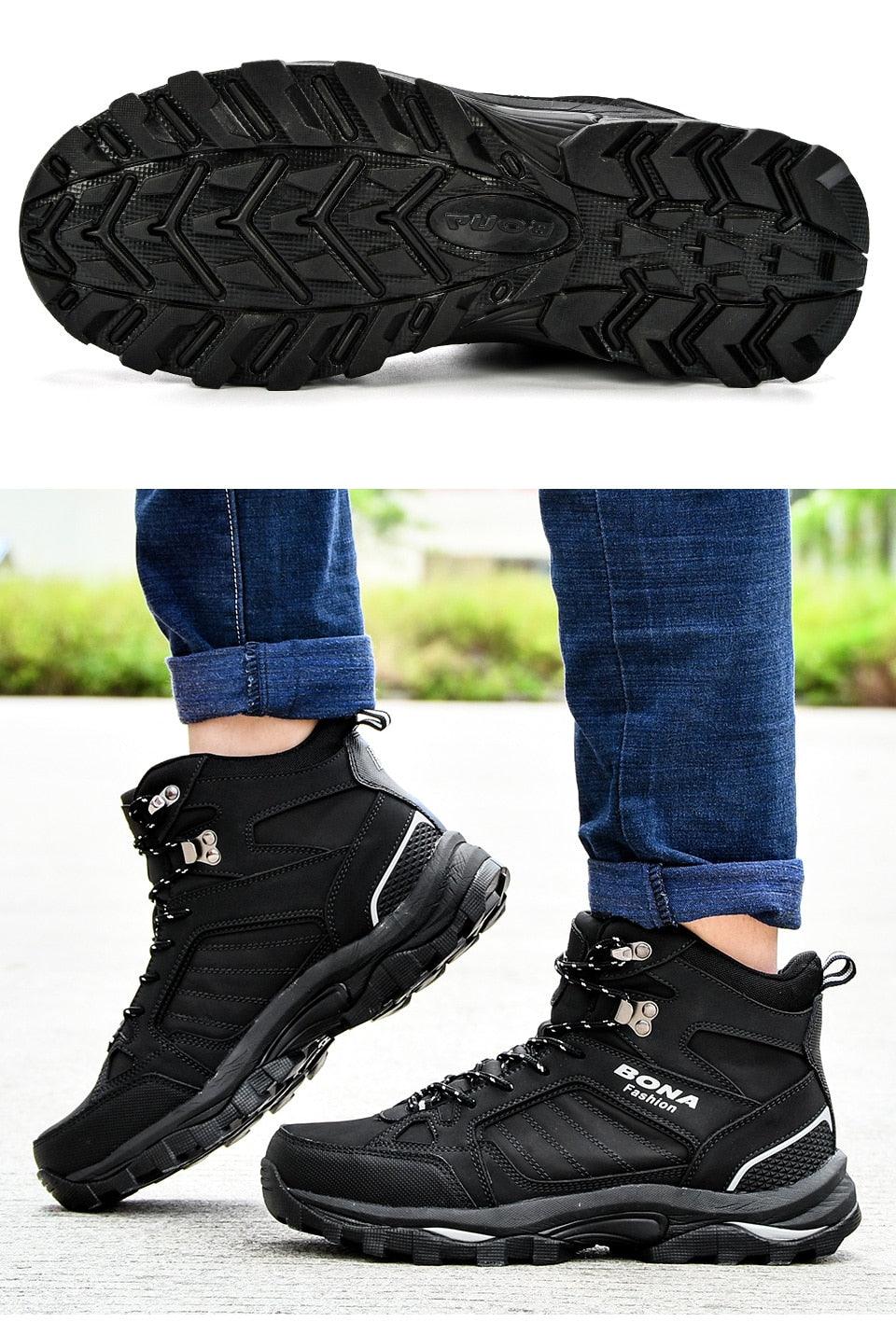Pair of men’s black lace-up winter boots with padded collar and chunky tread sole