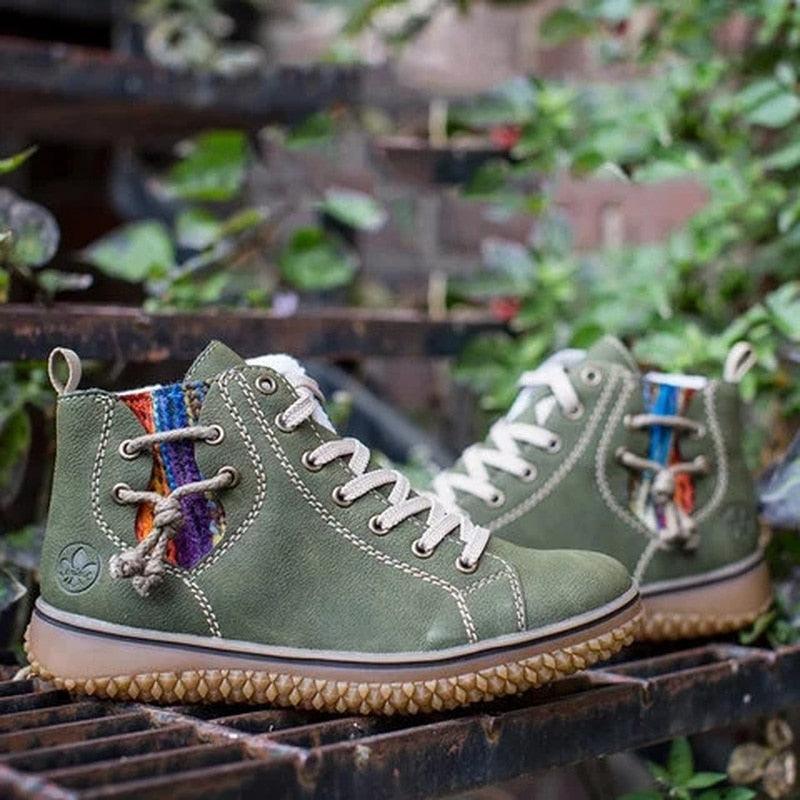 Green high-top ankle boots with lace-up front, plush lining, and textured rubber sole