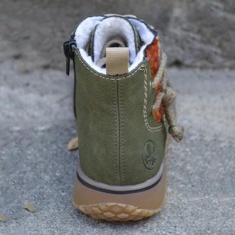 Olive green ankle boot with plush padded collar lining and textured rubber outsole