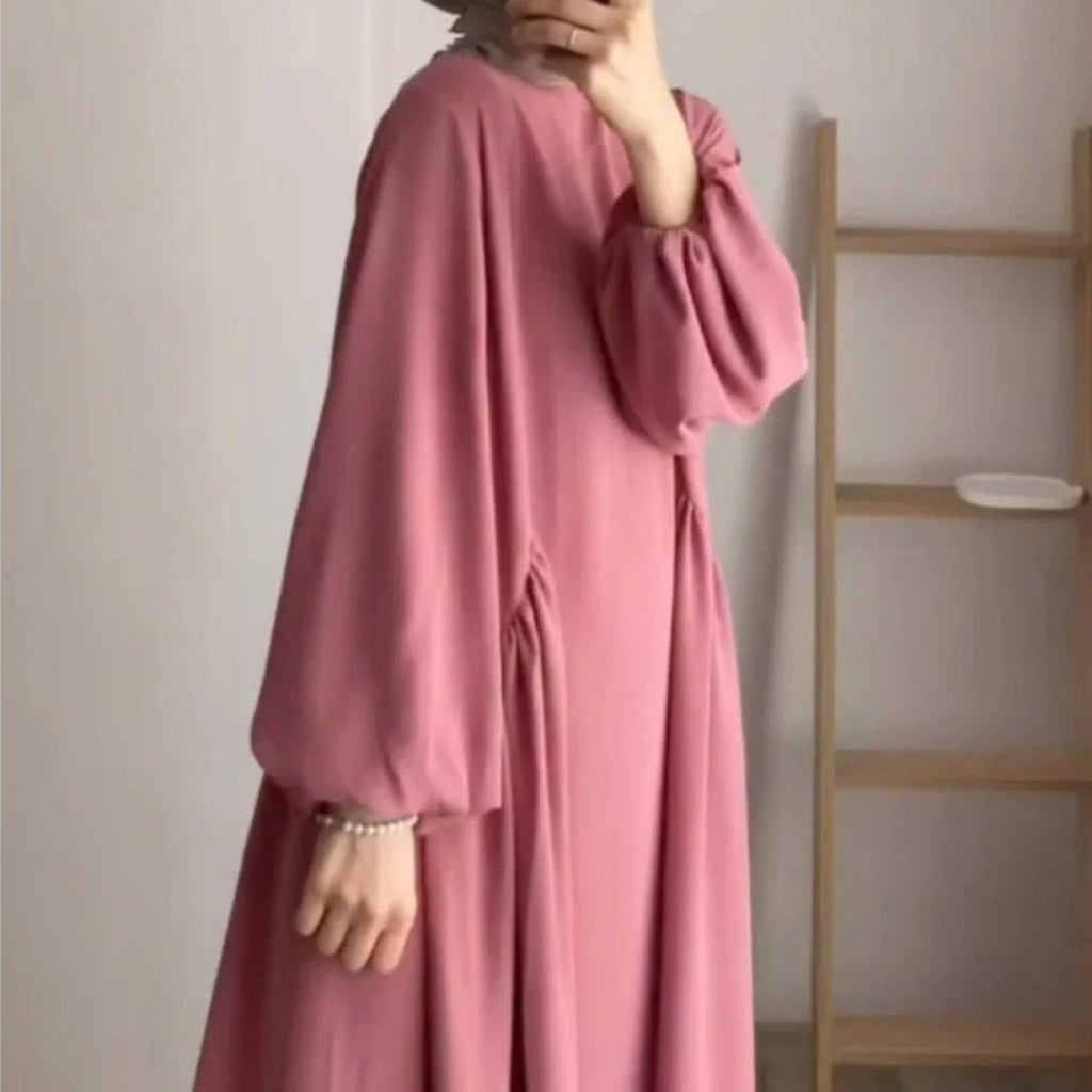 Blush pink loose-fit pullover abaya with lantern sleeves and gathered cuffs