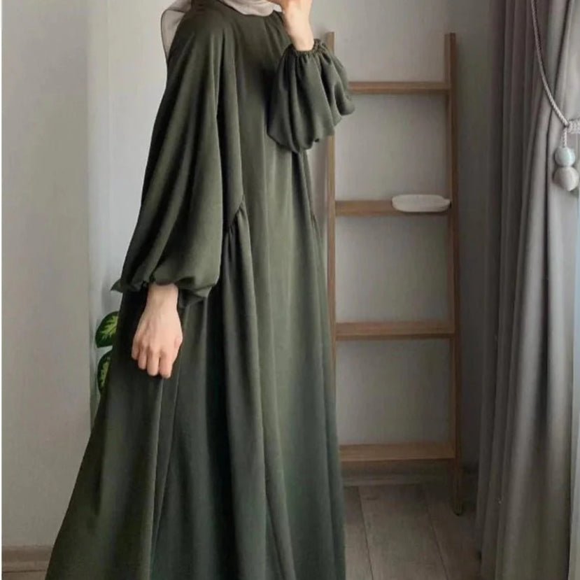 Loose-fit olive abaya with hood, lantern sleeves, and tiered drape