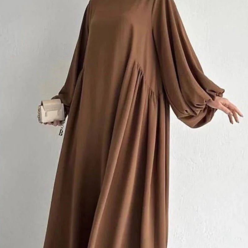 Coffee-brown abaya with pleated skirt and wide lantern sleeves