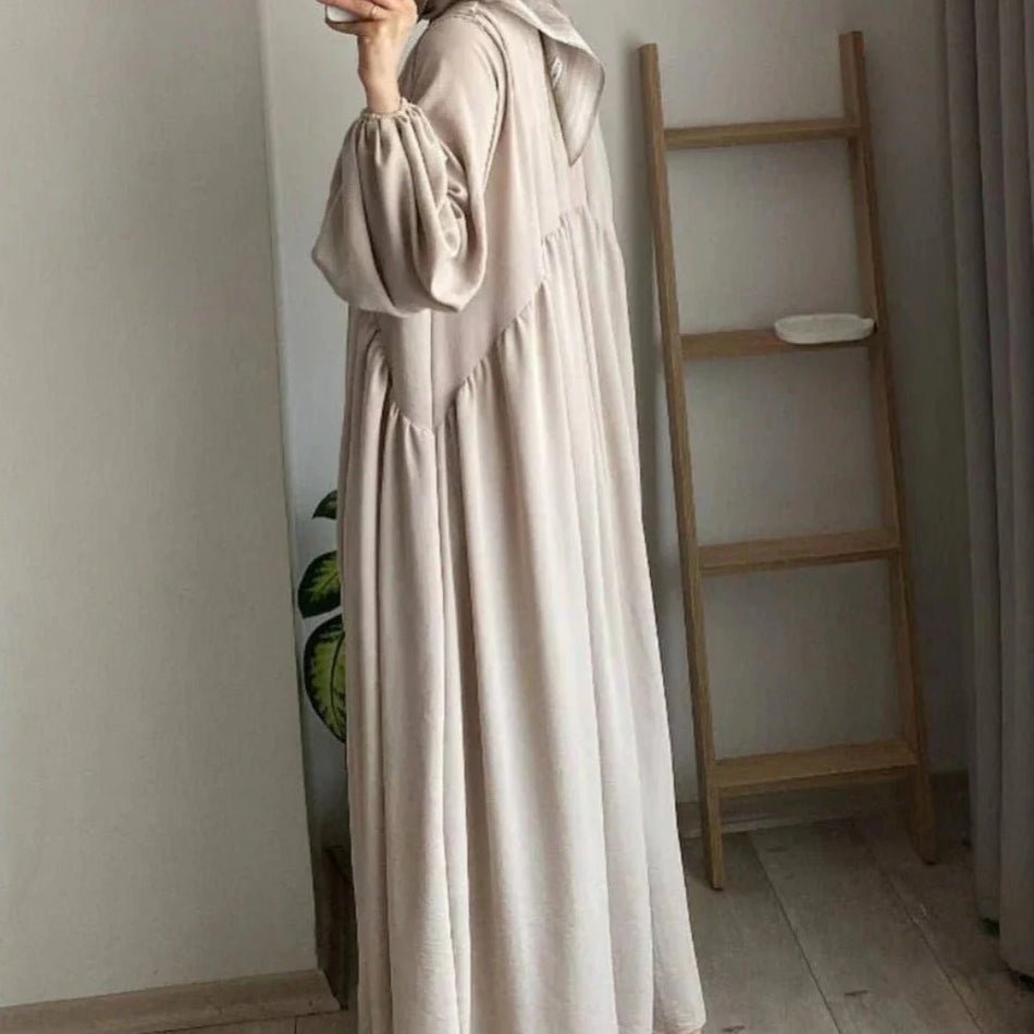 Cream loose-fit pullover abaya with lantern sleeves and gathered cuffs