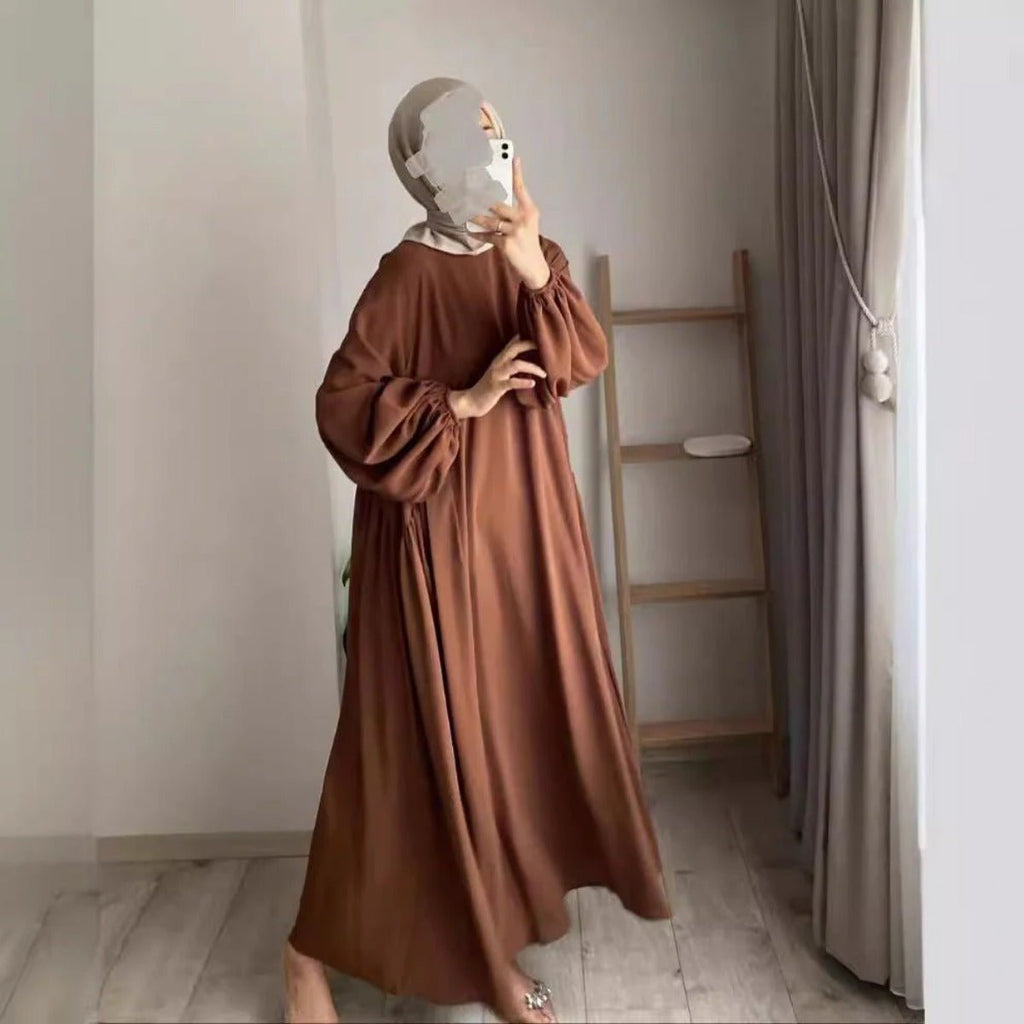 Brown pullover abaya with lantern sleeves, loose shape, and modest round neck