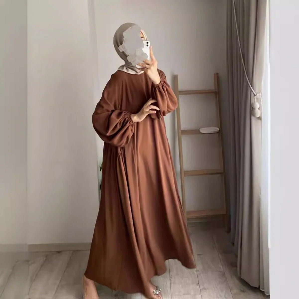 Brown pullover abaya with lantern sleeves, loose shape, and modest round neck