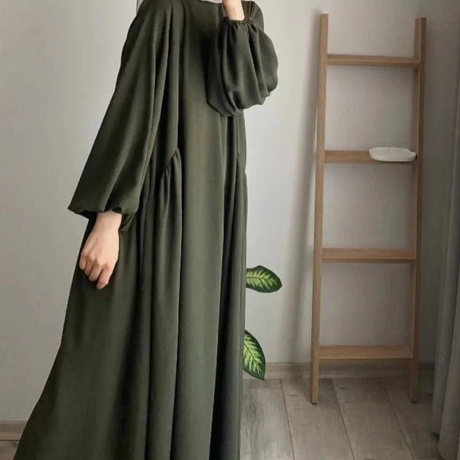 Olive pullover abaya with lantern sleeves and full skirt with vertical gathers