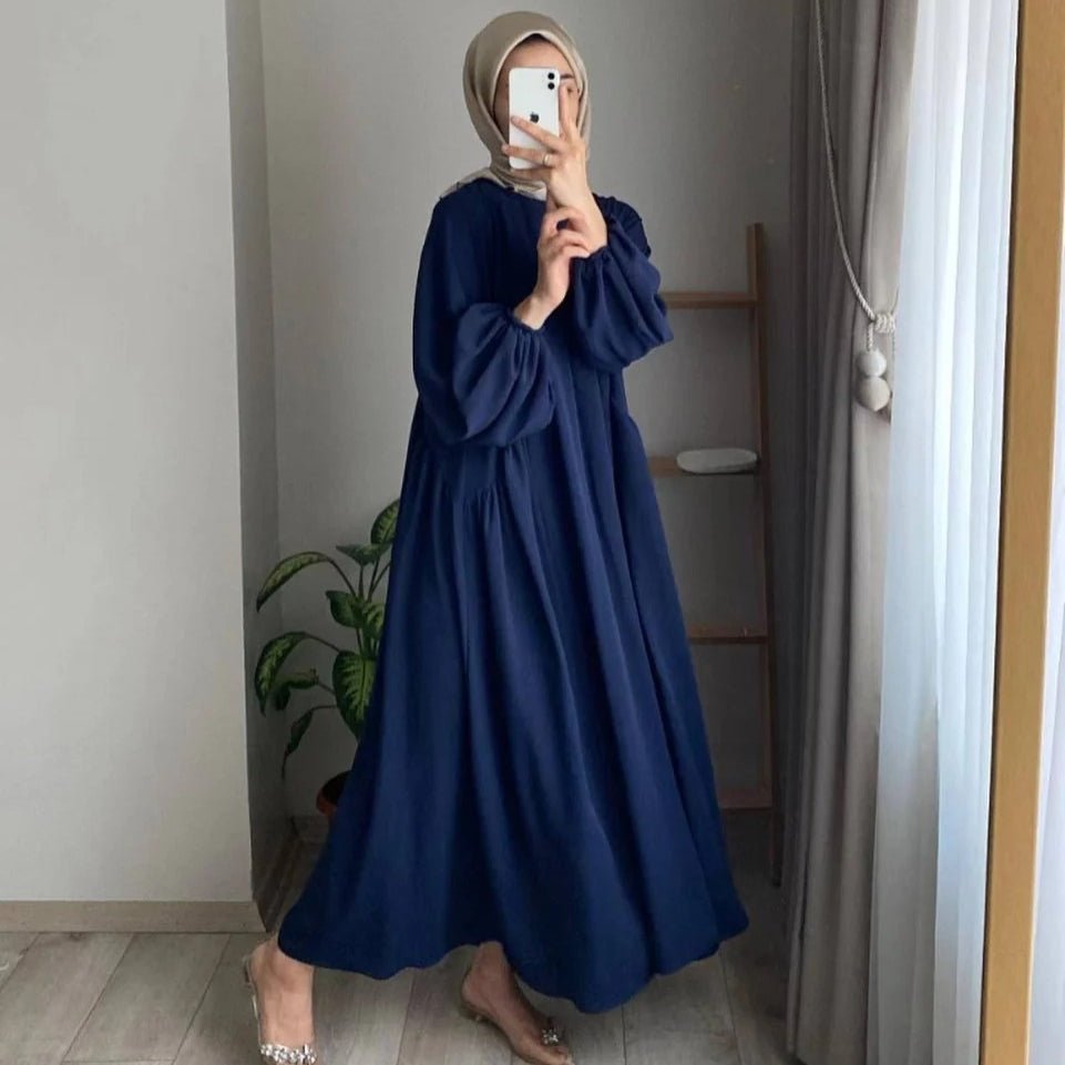 Navy pullover abaya with hood, lantern sleeves, and flowing A-line hem
