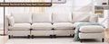 Beige L-shaped modular sectional sofa with matching movable ottoman and plush cushions