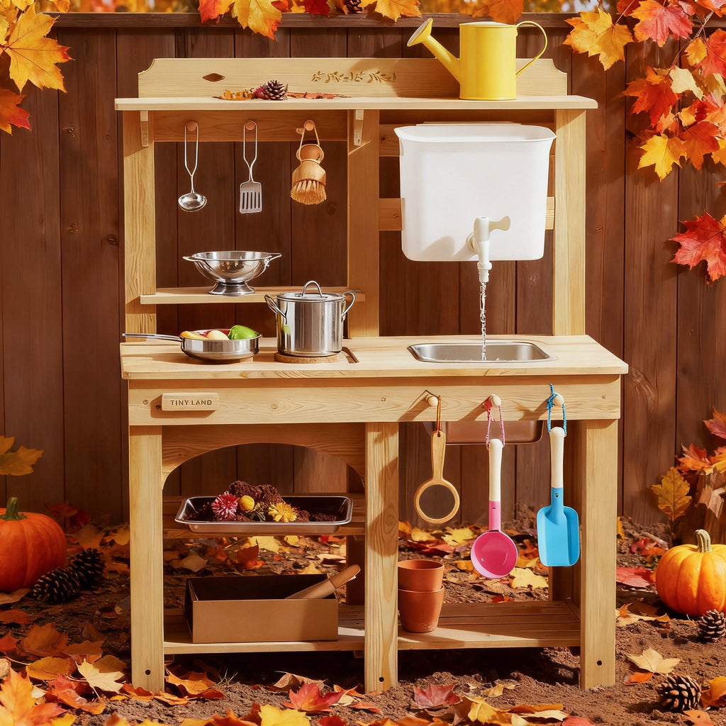 Kids' wooden outdoor mud kitchen with mud tank, sink, pots, and hanging tools